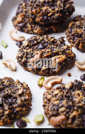 Healthy vegan quinoa cookies with nuts and chocolate, close-up. Stock Photo