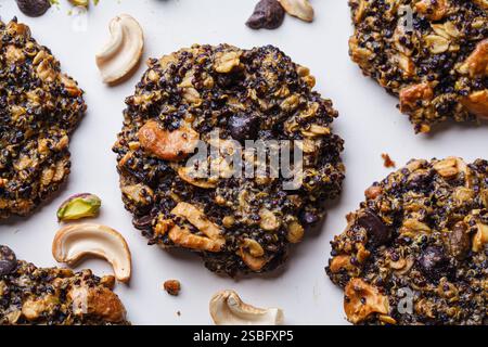 Healthy vegan quinoa cookies with nuts and chocolate, top view. Stock Photo