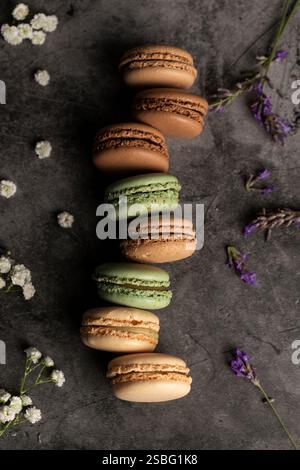Colorful, French macarons with some flowers Stock Photo