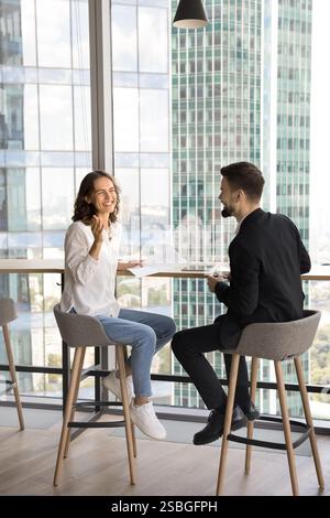 Two professionals having conversation in modern office Stock Photo