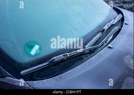 Frozen windshield on the car in winter in the icy cold with frost in the morning Stock Photo