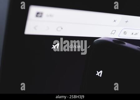 Close-up of a screen displaying the Grok logo and the x.ai website in a web browser. February 3, 2025 Stock Photo