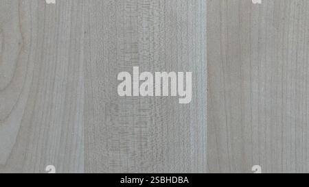 A close view of a light-colored wooden surface showcasing unique grain patterns. Stock Photo
