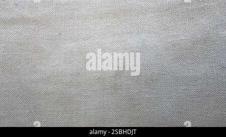 Light-colored fabric is emphasized, showcasing its fine weave and soft texture. Stock Photo