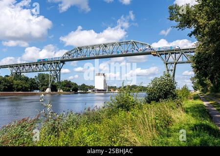 Hochdonn, Germany - August 11, 2024: Hochdonn High Bridge crossing the Kiel Canal with regional train in Hochdonn, Germany. Stock Photo