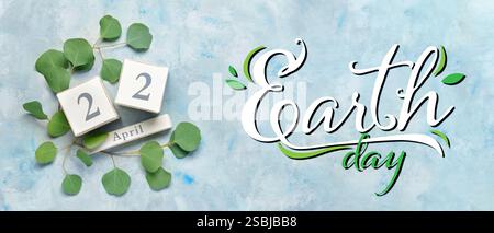 Calendar and plants on light blue background. Banner for Earth Day Stock Photo