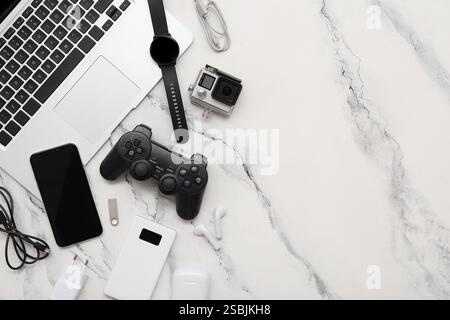 Set of different modern gadgets with laptop on light background Stock Photo