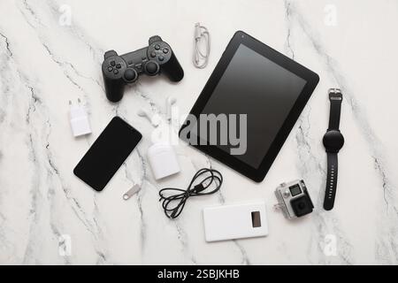 Set of modern gadgets with tablet computer on light background Stock Photo