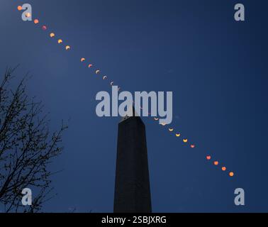 A composite showing the progression of a partial solar eclipse over the Washington Monument, Monday, April 8, 2024, in Washington. A total solar eclipse appeared across the Pacific coast of Mexico to the Atlantic coast of Newfoundland, Canada. A partial solar eclipse was visible across the entire North American continent. Stock Photo