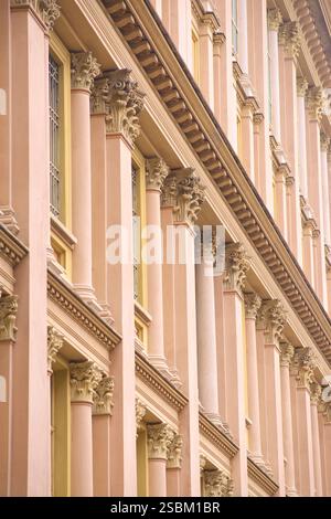 Detail of the side of the Mole Antonelliana, a major landmark building in Turin, Italy, named after its architect, Alessandro Antonelli. A mole in Italian is a building of monumental proportions. Construction began in 1863, soon after Italian unification, and was completed in 1889, after the architect's death. Originally conceived of as a synagogue, it now houses the National Museum of Cinema, and is believed to be the tallest museum in the world Stock Photo