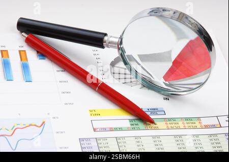 Graphs tables and documents laid on the table Stock Photo