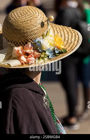 Woman Wearing Stylish Straw Hat with Floral Decoration Outdoors Stock Photo