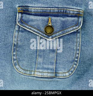 Blue stone washed denim pocket and metal button detail cotton fabric texture background Stock Photo