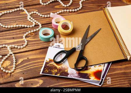 Crafting supplies on a wooden table ready for creative projects in a cozy workspace Stock Photo