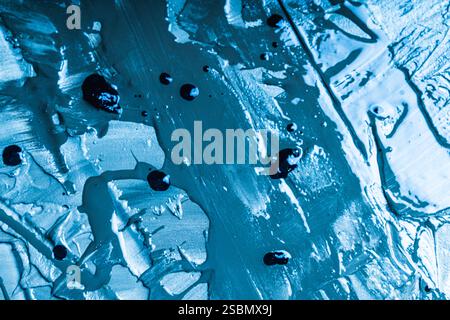 Abstract background with the texture of plaster or oil paint in rich blue color. Seamless background with large brush strokes. Rough stylized texture Stock Photo