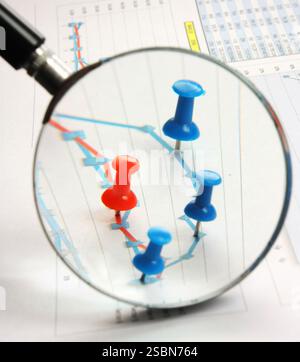 Graphs tables and documents laid on the table Stock Photo
