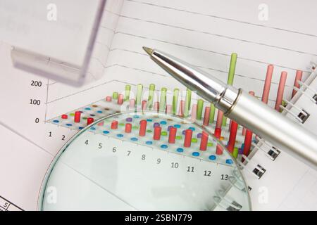 Graphs tables and documents laid on the table Stock Photo