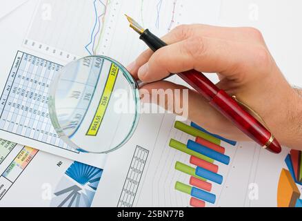 Graphs tables and documents laid on the table Stock Photo