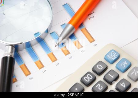 Graphs tables and documents laid on the table Stock Photo