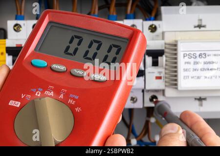 Digital Multimeter Measuring Electrical Circuit Stock Photo