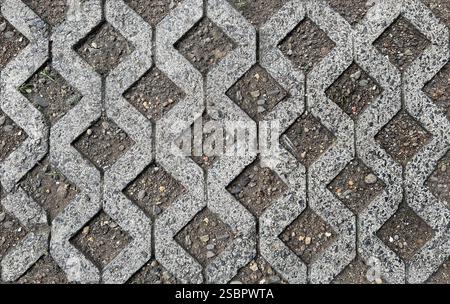 Close up of molded grey paving stone in diamond pattern. This diamond shape paving is used mostly in car park, car port, or landscape garden for floor Stock Photo