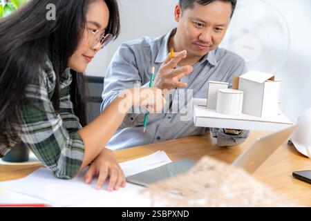 Two young architects working at the office. Stock Photo