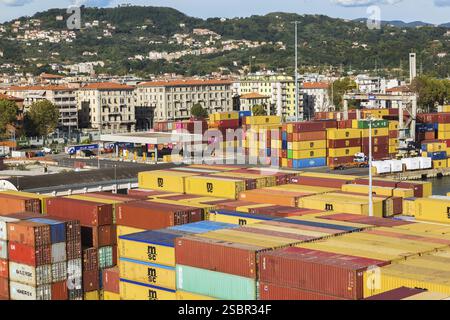 High angle view of rows of stacked rectangular metal box shipping containers on dock in La Spezia cargo Port, Italy, Europe Stock Photo