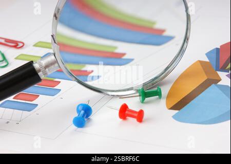 Graphs tables and documents laid on the table Stock Photo