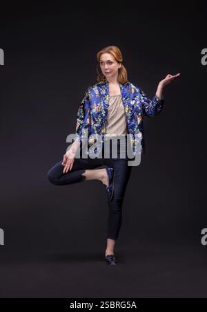 Beautiful adult profi model full length portrait at black background Stock Photo