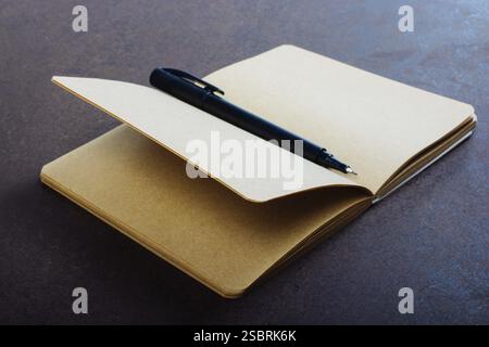 White notebook on a brown color background inthe view Stock Photo