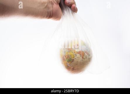 World globe in plastic bag isolated on white background Stock Photo