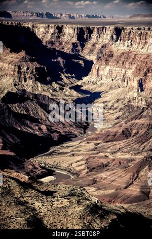 A canyon with a river running through it. The canyon is very deep and the river is very wide Stock Photo