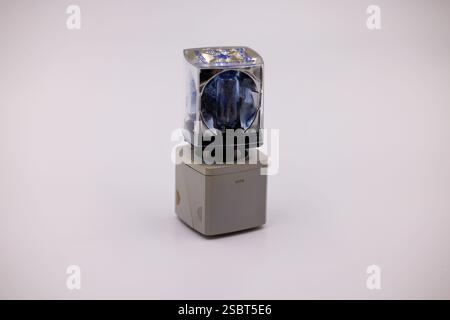 Philips flash cube on top of Kodak instamatic flashcube holder. Retro photographic film camera lighting equipment isolated on white background. Stock Photo