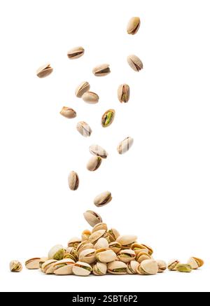 Pistachios falling on bunch isolated on white background. Stock Photo