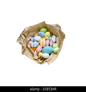 Easter eggs painted in craft paper packaging on a transparent background. Stock Photo