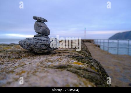 rocks balanced on wall Stock Photo
