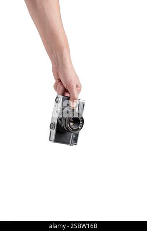Old camera in hand isolated on white background Stock Photo