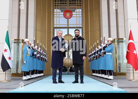 (250204) -- ANKARA, Feb. 4, 2025 (Xinhua) -- Turkish President Recep Tayyip Erdogan (L) shakes hands with Syria's interim President Ahmed al-Sharaa at the Presidential Complex in Ankara, T¨¹rkiye, on Feb. 4, 2025. Erdogan and Al-Sharaa on Tuesday reaffirmed their commitment to fully restoring relations and enhancing cooperation between their two countries. (Mustafa Kaya/Handout via Xinhua) Stock Photo