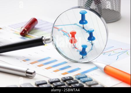 Graphs tables and documents laid on the table Stock Photo