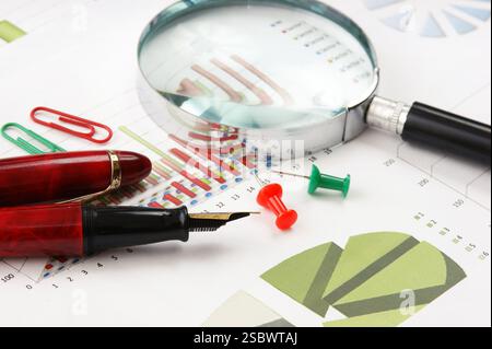 Graphs tables and documents laid on the table Stock Photo