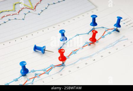 Graphs tables and documents laid on the table Stock Photo