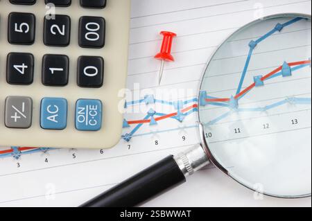Graphs tables and documents laid on the table Stock Photo