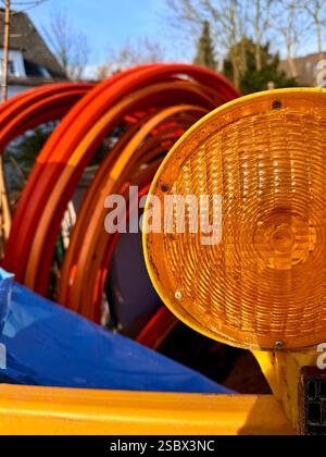 Coiled black PVC hoses with a blue lines. Polyethylene tubing, pipe material at construction site. High quality photo Stock Photo