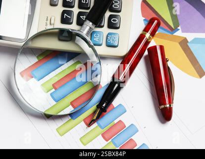 Graphs tables and documents laid on the table Stock Photo