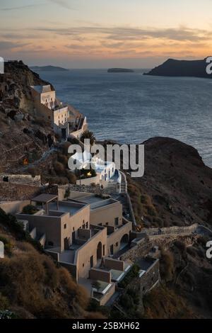 View over the stairway to Amoudi Bay and the Londsa Castle in Oia on Santorini at dusk Stock Photo
