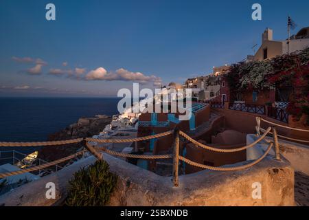 Dawn over the alleys, holiday homes and flats in Oia, Greece Stock Photo