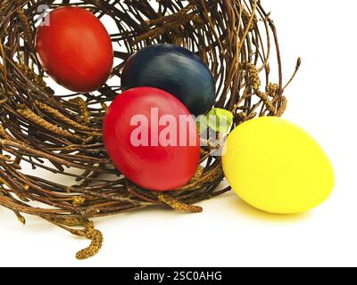 Easter Nest With Multicolored Eggs Against White Stock Photo