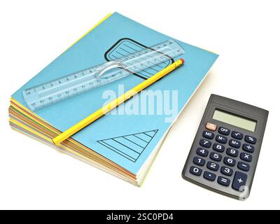 Notebooks Stack With Ruler And Pencil Near Calculator Against The White Background Stock Photo