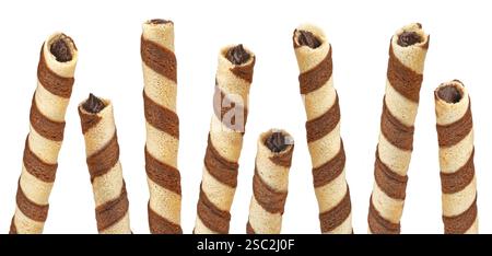 Waffle rolls, striped chocolate and vanilla wafer sticks isolated on white background, full depth of field Stock Photo