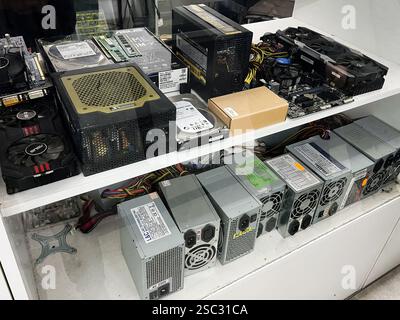 Kyiv, Ukraine - February 04, 2025: Various computer components and peripherals neatly arranged on a display shelf for viewing. Stock Photo